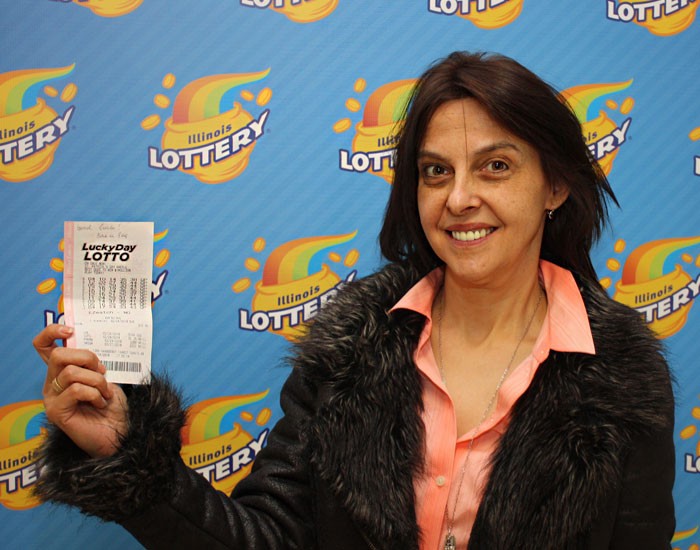 Ivanka Detchevska holds her winning $100,000 Lucky Day Lotto ticket