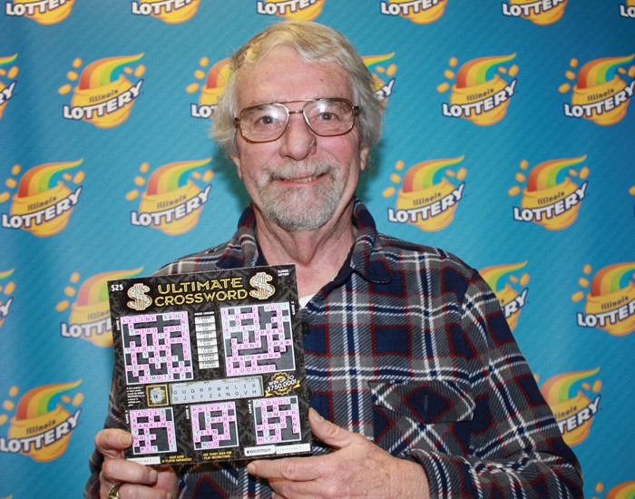 Bruce Chennell holds his winning Ultimate Crossword ticket