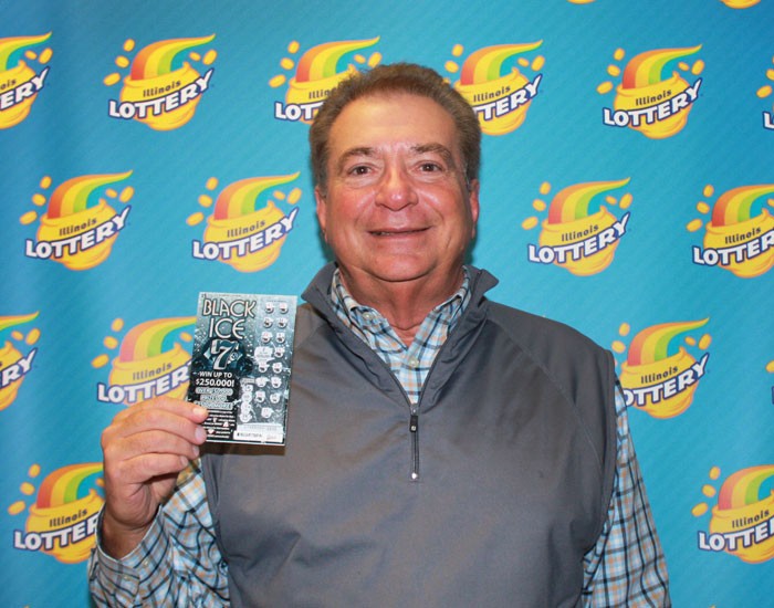 Samuel Zammuto holds his winning Black Ice 7s ticket. 