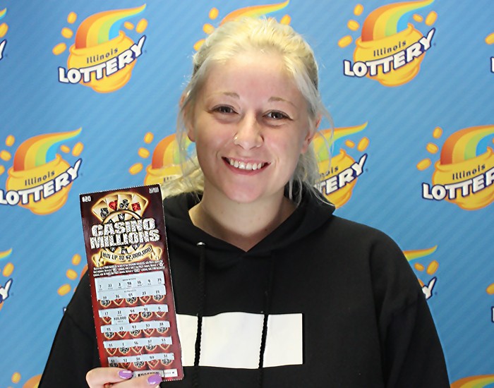Chelsea Neuling holds her winning Casino Millions instant ticket.