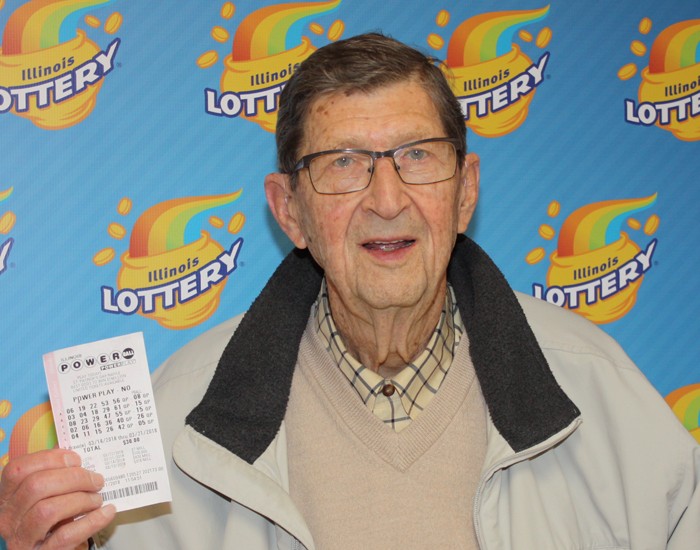 Robert Schuit holds his winning $1,000,000 Powerball ticket.