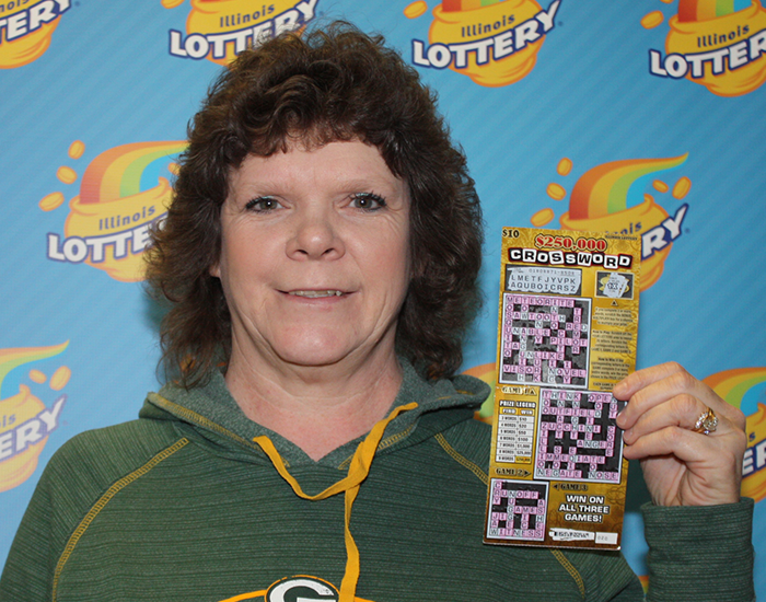 Evelyn Zimmerman holds her winning $250,000 Crossword instant ticket.